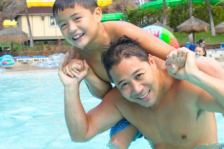 a man swimming in a pool of water