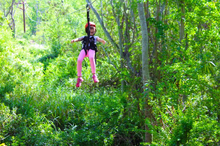 small child on zipline at Coral Crater