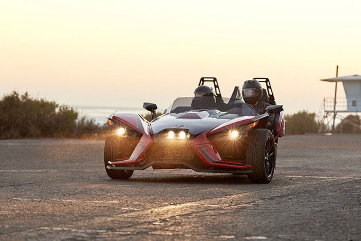 a person driving a race car on a road