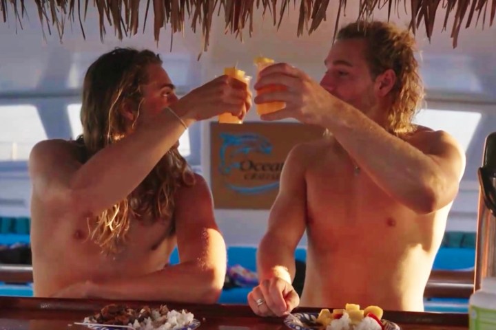 a group of people sitting at a table eating food